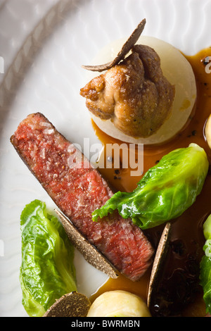 Danish Beef with Celery, Small Cabbages, Sweetbreads and Black Truffles prepared by Kristian Meller and Rune Jochumsenat, Chefs Stock Photo