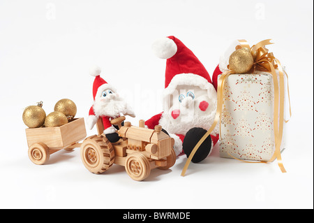 Christmas present, two gnomes and toy tractor Stock Photo