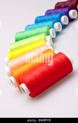 multi-colored rainbow threads for sewing Stock Photo