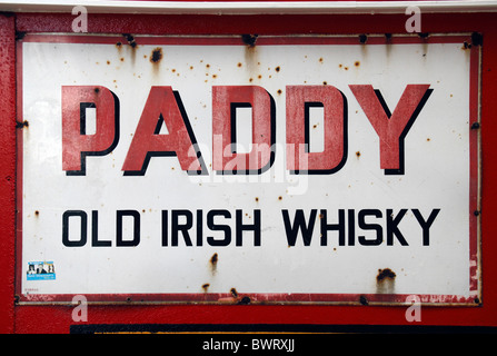 An old fashioned metallic sign advertising Paddy Old Irish Whisky, in Wexford Town, Co. Wexford, Ireland (Eire). Stock Photo