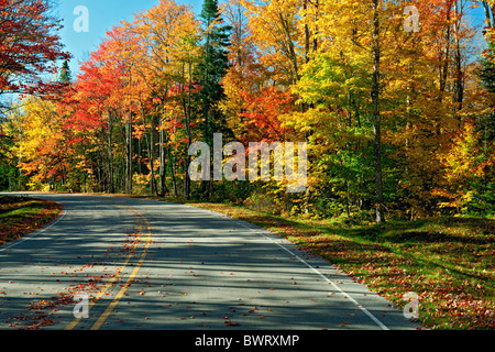 Highway 58 passes through the autumn splendor of the Pictured Rocks National Lakeshore and Michigan's Upper Peninsula. Stock Photo