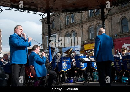 The Stacksteads Brass Band from Rossendale performing in Burnley town Centre in Lancashire England Stock Photo