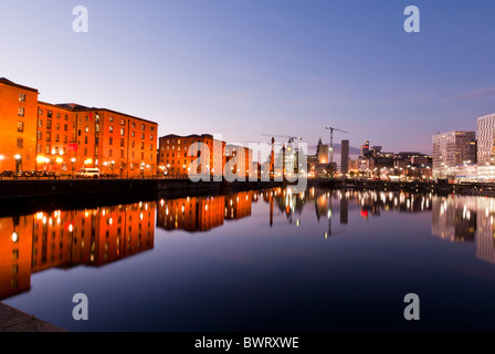 Warehouses reflected in water at the Albert Docks, Liverpool, England, UK Stock Photo