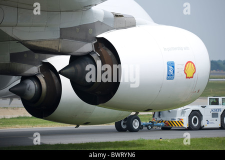 Airbus A380 the worlds largest passenger plane being towed to stand, two Rolls Royce engines in foreground Stock Photo