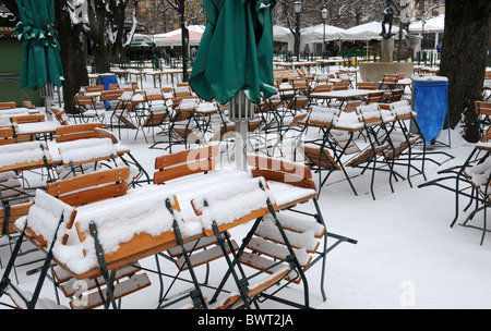 Snow-covered beer garden in Munich Stock Photo