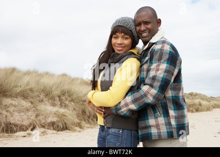 Romantic Young Couple On Winter Beach Stock Photo