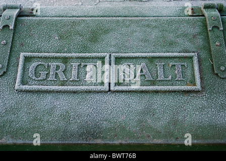 Roadside grit box with the words grit and salt covered in frost. Stock Photo