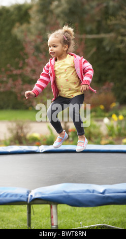 Girl Playing On Trampoline Stock Photo