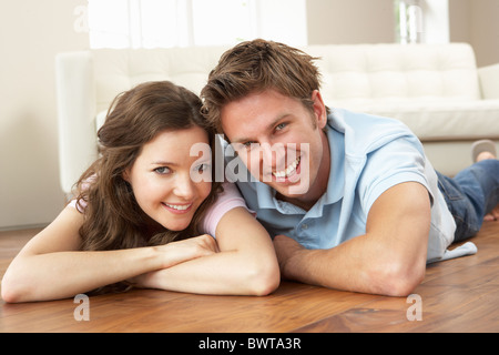 Affectionate Couple Relaxing At Home Together Stock Photo
