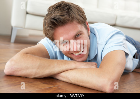 Young Man Relaxing At Home Stock Photo