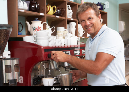 Man Making Coffee In Café Stock Photo