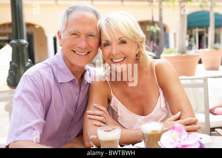 Senior Couple Enjoying C,fee And Cake In Café Stock Photo
