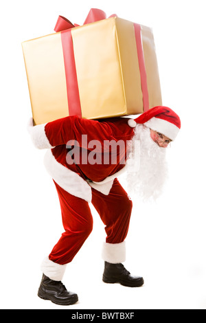 Photo of happy Santa Claus carrying big giftbox on his back Stock Photo