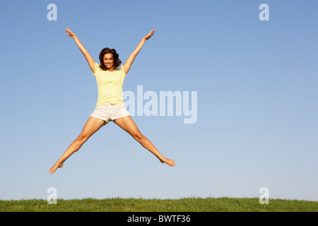 Young woman  jumping in air Stock Photo
