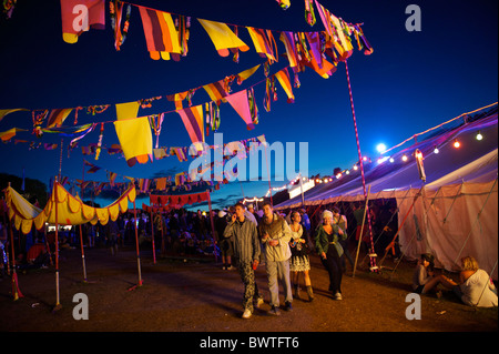 Music revelers take in the quieter moments of Bestival 2010 in Newport, Isle of Wight, England on September 12, 2010. Stock Photo