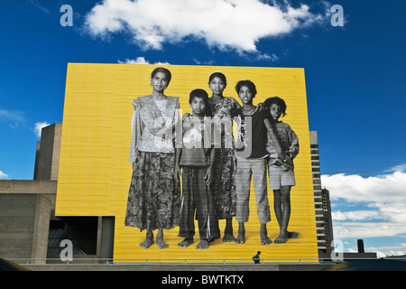 Giant advertisement at the National Theatre South Bank London England Stock Photo