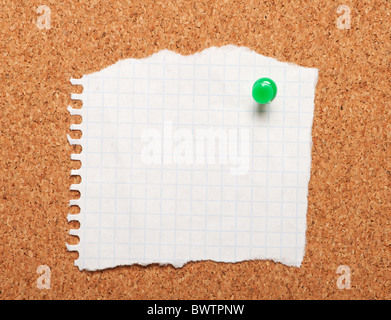 Closeup of piece of paper on a cork board Stock Photo