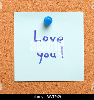 Note with 'i love you' confession on a cork board Stock Photo