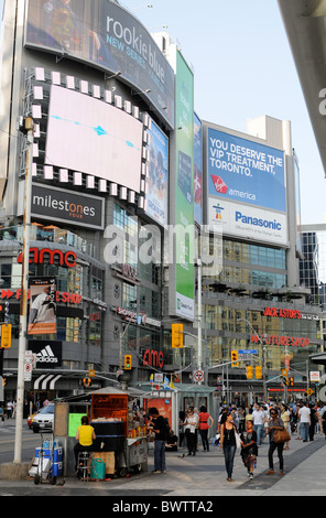 Glass, steel, billboards and people on the move, a sunny day at Yonge Dundas, Toronto, Canada Stock Photo