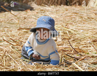 Portrait of a child living on the Floating Islands of Lake Titicaca, which were made of reeds by the Uros people. Stock Photo