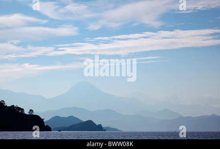 Early morning wispy clouds over Fethiye Bay Turkey with Baba Dagi mountain on the horizon Stock Photo