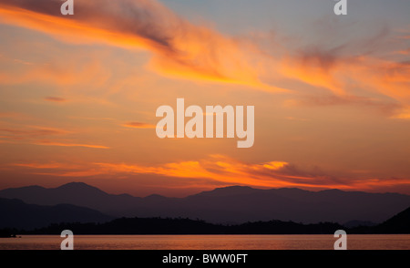 Early morning wispy clouds over Fethiye Bay Turkey with Baba Dagi mountain on the horizon Stock Photo