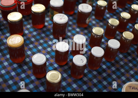 Pots of Honey on a chequered table cloth in Turkey Stock Photo