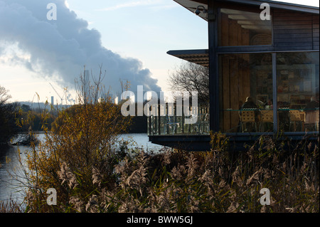 Visitors in the centre cafe, Attenborough Nature Reserve with Ratcliffe on Soar power station in background Stock Photo