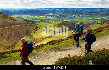 Walkers on Offas Dyke path with view of the market town Ruthin and the Vale of Clwyd. North Wales UK Stock Photo