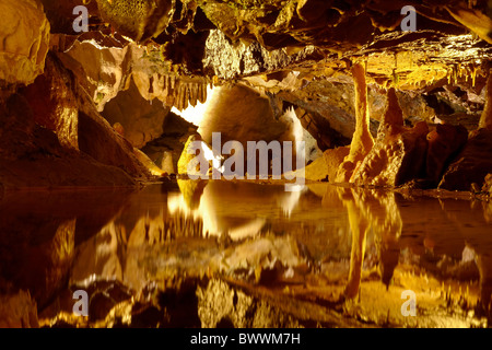 Stalactites and stalagmites reflected in pool, Gough's Cave, Cheddar Caves, Somerset, England, United Kingdom Stock Photo