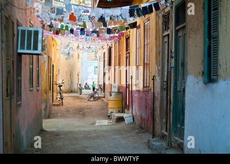 Narrow street decorated in preparation for Ramadan, Al-Quseir, Egypt. Stock Photo