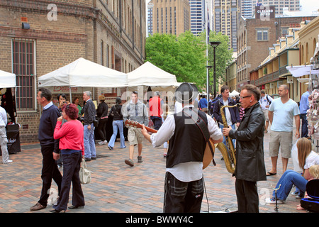 Buskers entertain the crowds at Rocks Market in Playfair Street, Sydney, New South Wales, NSW, Australia, Australasia Stock Photo