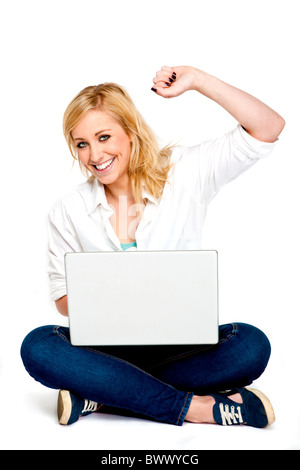 Beautiful Young Woman Celebrating success on her Laptop Stock Photo