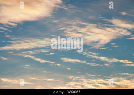 Parhelion or sundog, caused by sunlight refracting off ice crystals in high cloud in the upper atmosphere, above Ambleside, Stock Photo