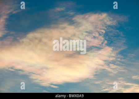 Parhelion or sundog, caused by sunlight refracting off ice crystals in high cloud in the upper atmosphere, above Ambleside, Stock Photo