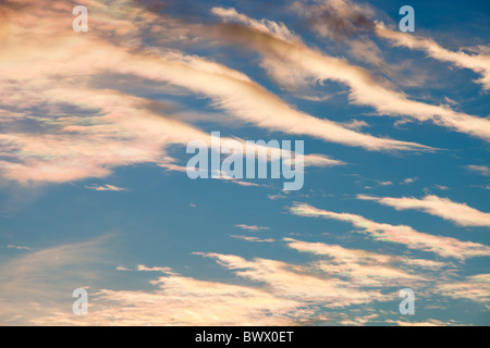 Parhelion or sundog, caused by sunlight refracting off ice crystals in high cloud in the upper atmosphere, above Ambleside, Stock Photo