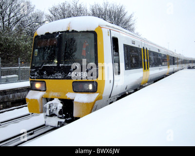 December 2010 - Snow covered train coming in to Hither Green station in South East London Stock Photo