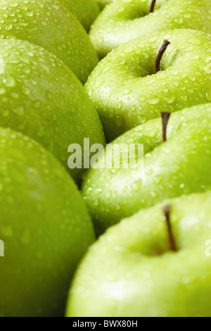 large group of granny smith apples in a row. Selective focus Stock Photo