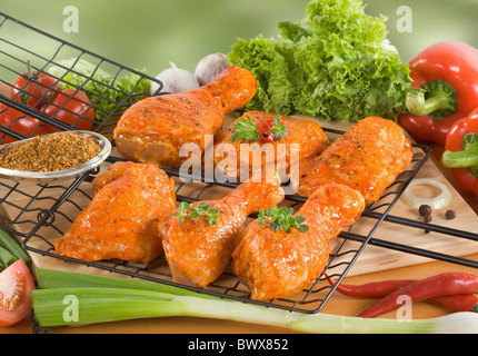 Marinated chicken legs ready to be grilled Stock Photo