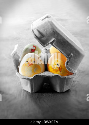 Hand painted chicken eggs with traditional Easter chicks design Stock Photo
