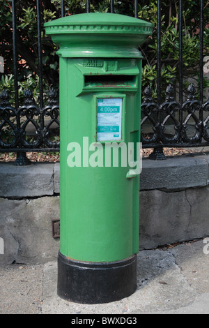 A green freestanding Irish Post Office (An Post) post box in Waterford City, Co. Waterford, Ireland (Eire). Stock Photo