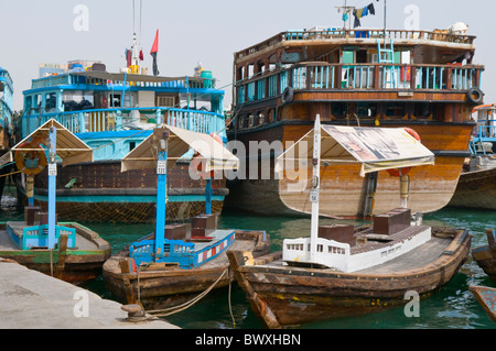 Traditional Dhows and Abra Water Taxis in Dubai Creek, United Arab Emirates Stock Photo