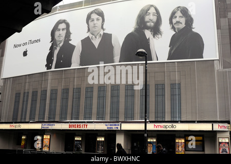 Giant iTunes poster of The Beatles hang on the HMV Apollo, London. Stock Photo