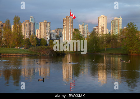 Apartments reflected in Vanier Park Pond, Vancouver, British Columbia, Canada Stock Photo