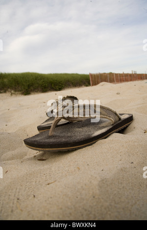 flip flops in sand on beach Stock Photo