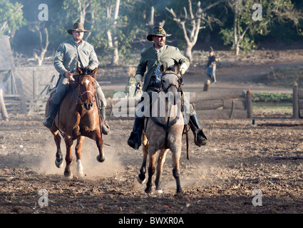Two Confederate soldiers leading the charge on horseback during Civil War Reenactment of Gettysburg Stock Photo