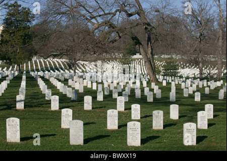 Rows of white grave stones fade into the distance in Arlington National Cemetery in Arlington, Virginia. Stock Photo