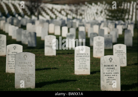 Rows of white grave stones fade into the distance in Arlington National Cemetery in Arlington, Virginia. Stock Photo