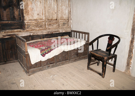 Old furniture in a room, Yunnan Horse Caravan Cultural Museum, Yunnanyi, Yunnan Province, China Stock Photo