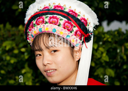 Bai woman wearing colourful traditional Bai headdress, Dali, Yunnan Province, China Stock Photo